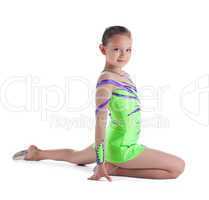 Girl posing in green - young gymnast isolated
