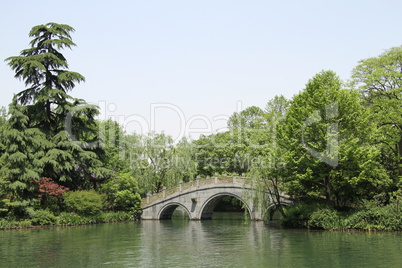 Stone arc bridge and trees