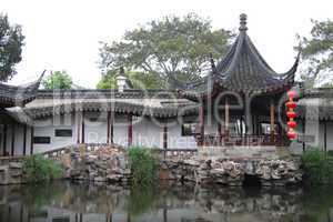 Pagoda and lake inside ancient gsarden