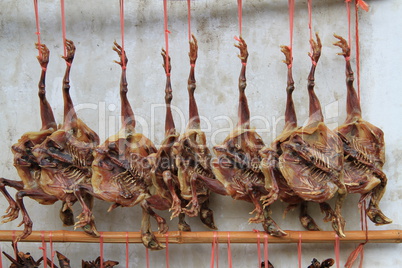 Smoked chikens near the wall