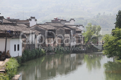 Houses on the riverbank in Shexian