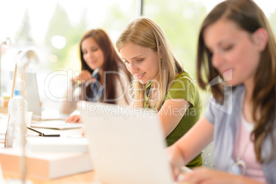 Happy female students during class