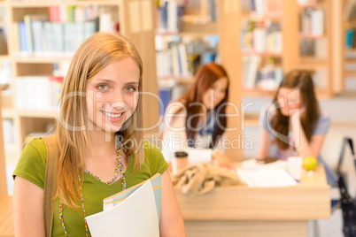 High school library teenage student in green