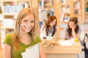 High school library teenage student in green