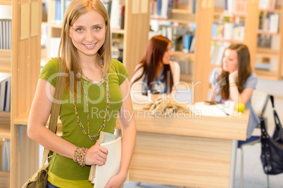 High school library teenage student in green