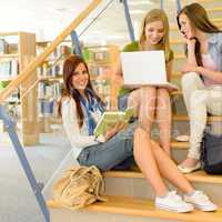 Group of high school classmates study library