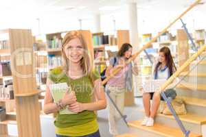 High school library teenage student in green