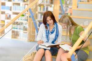 High school library students sitting on stairs