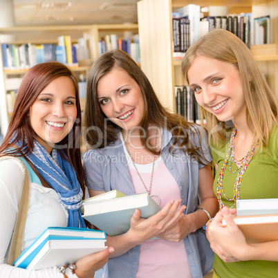 High school classmates with library books