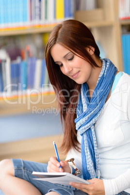 High school student at library make notes