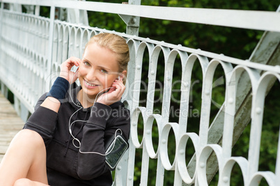 Listening to music headphones young woman resting