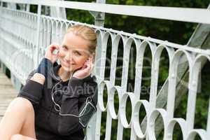 Listening to music headphones young woman resting