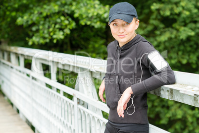 Teenage girl outdoor in sport outfit jogging
