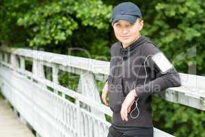 Teenage girl outdoor in sport outfit jogging