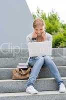 Young student woman outdoor with laptop