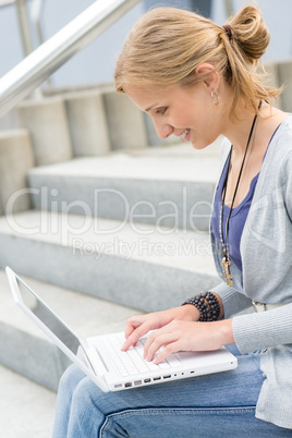 Young woman working on her laptop computer