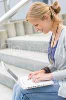 Young woman working on her laptop computer