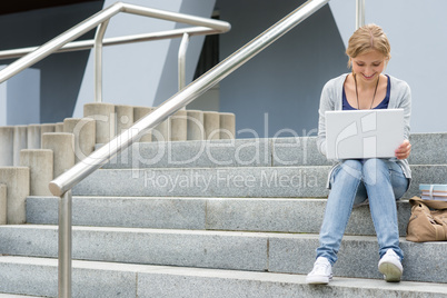 Teenage girl working on her laptop computer