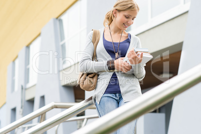 Woman holding her books to school young