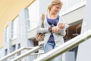 Woman holding her books to school young