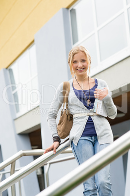 Teenage girl holding books to school