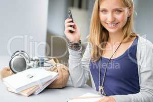 Student woman with notes and cellphone