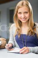 Student girl with notes and cellphone