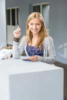 Happy student girl outdoor with notepad
