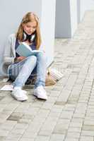 Teenage student girl study outdoor siting ground