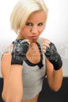 Woman ready to fight with kickbox gloves