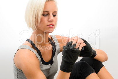 Kickbox woman put on protective gloves fitness
