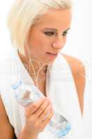 Attractive blond fitness woman with water bottle
