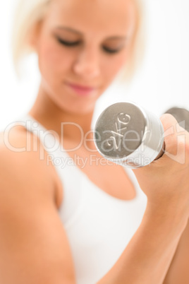 Woman lifting 2KG dumbbells exercise biceps