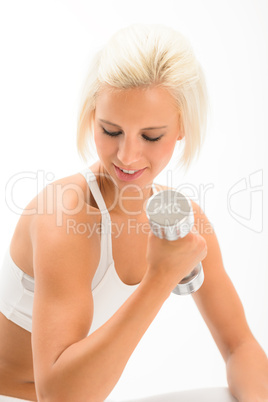 Woman lifting 2KG dumbbells exercise biceps Woman lifting 2KG dumbbells exercise biceps