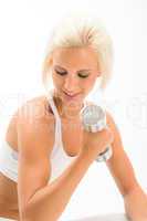 Woman lifting 2KG dumbbells exercise biceps