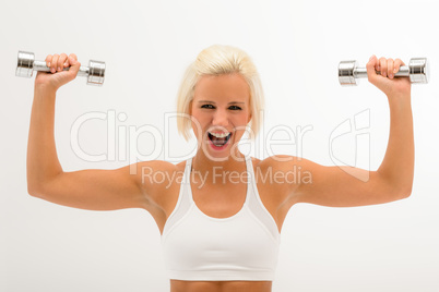 Cheerful fitness woman lift dumbbells isolated white