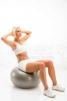 White fitness woman exercise on silver ball