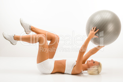Woman with fitness ball exercise abdominals white