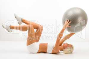 Woman with fitness ball exercise abdominals white