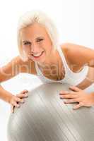 Woman fitness ball exercise on white background