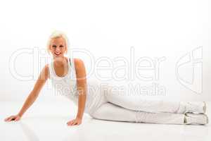 Fitness woman stretch body at Pilates exercise.