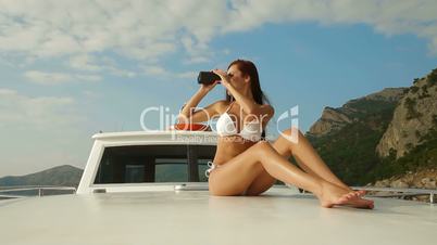 Bikini Beauty With Binoculars on Yacht