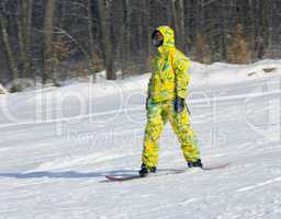 Snowboarder in a yellow suit