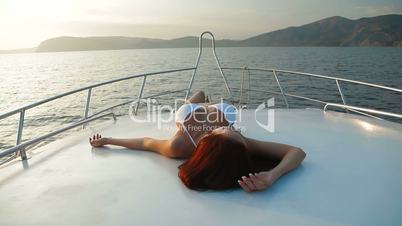 Bikini Female Sunbathing on Luxury Yacht