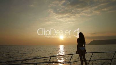 Female Silhouette on Yacht at Sunset