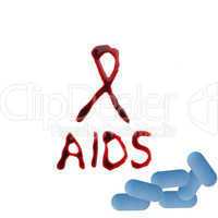 Aidsschleife mit Blut geschrieben & Pillen / Tabletten