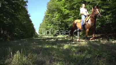 slow motion woman riding horse