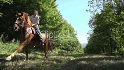 slow motion woman riding galloping horse