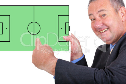 Man pointing at sign with football field