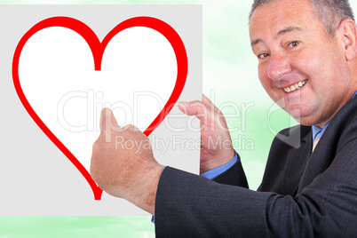 Man holding and pointing at sign with heart